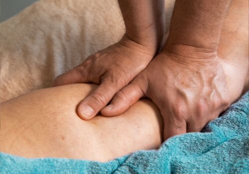 Photo of a physiotherapist working on a knee